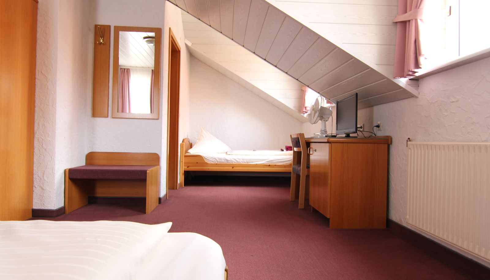 Dreibett- und Vierbettzimmer